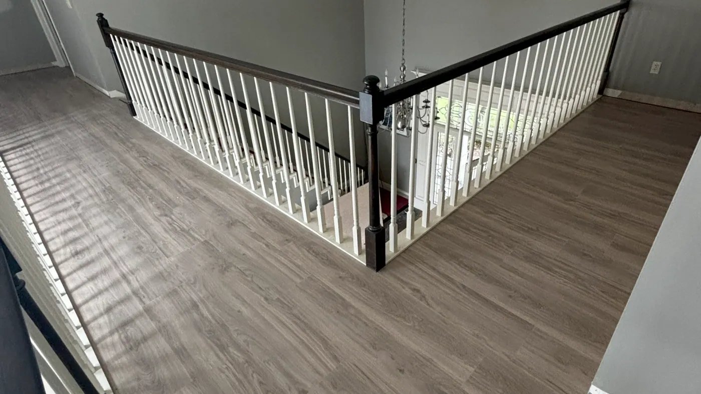 Hardwood floor installation on an upstairs landing in a Tulsa metro home
