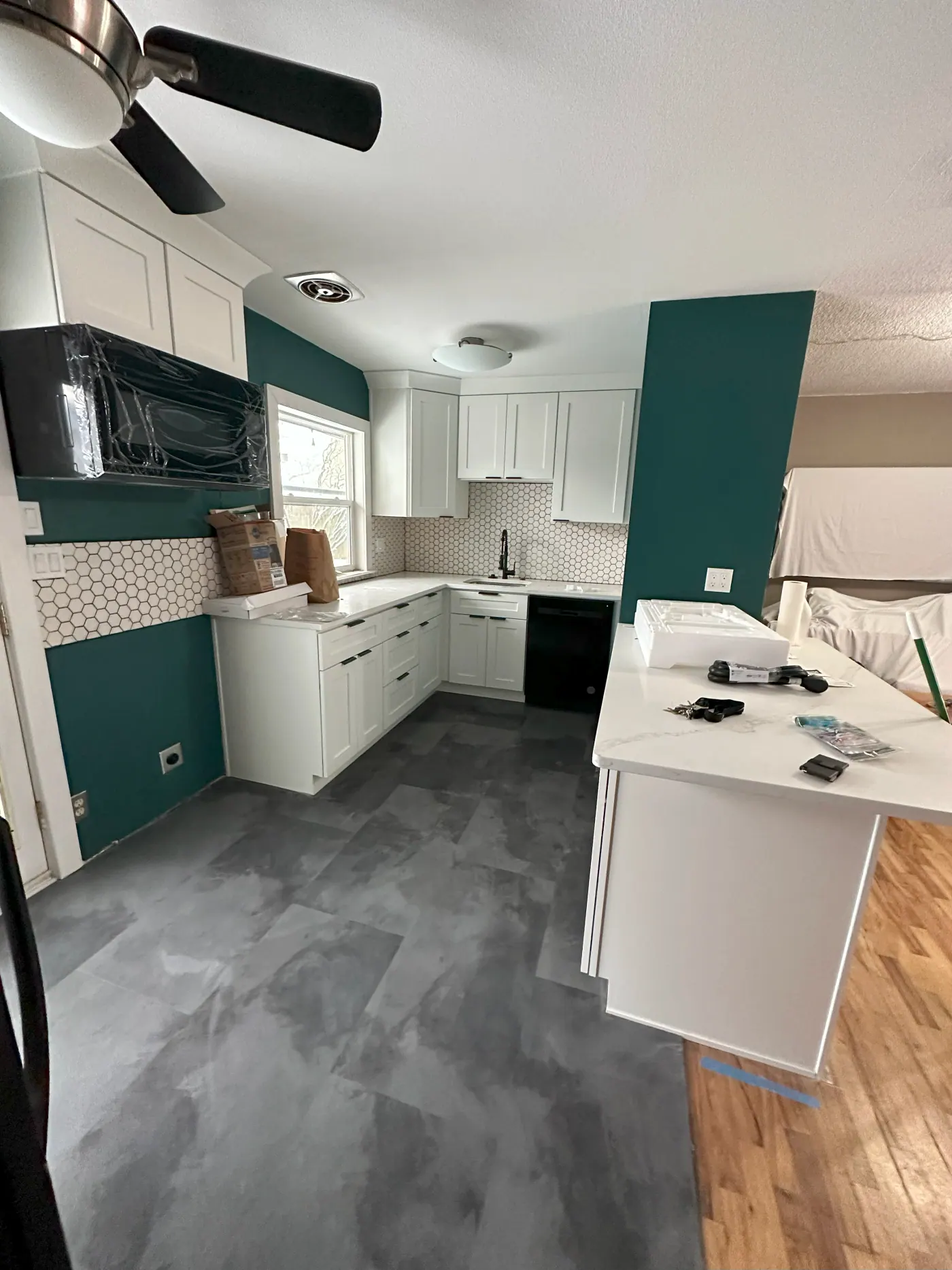 Kitchen tile flooring being set during a remodel in Tulsa, OK
