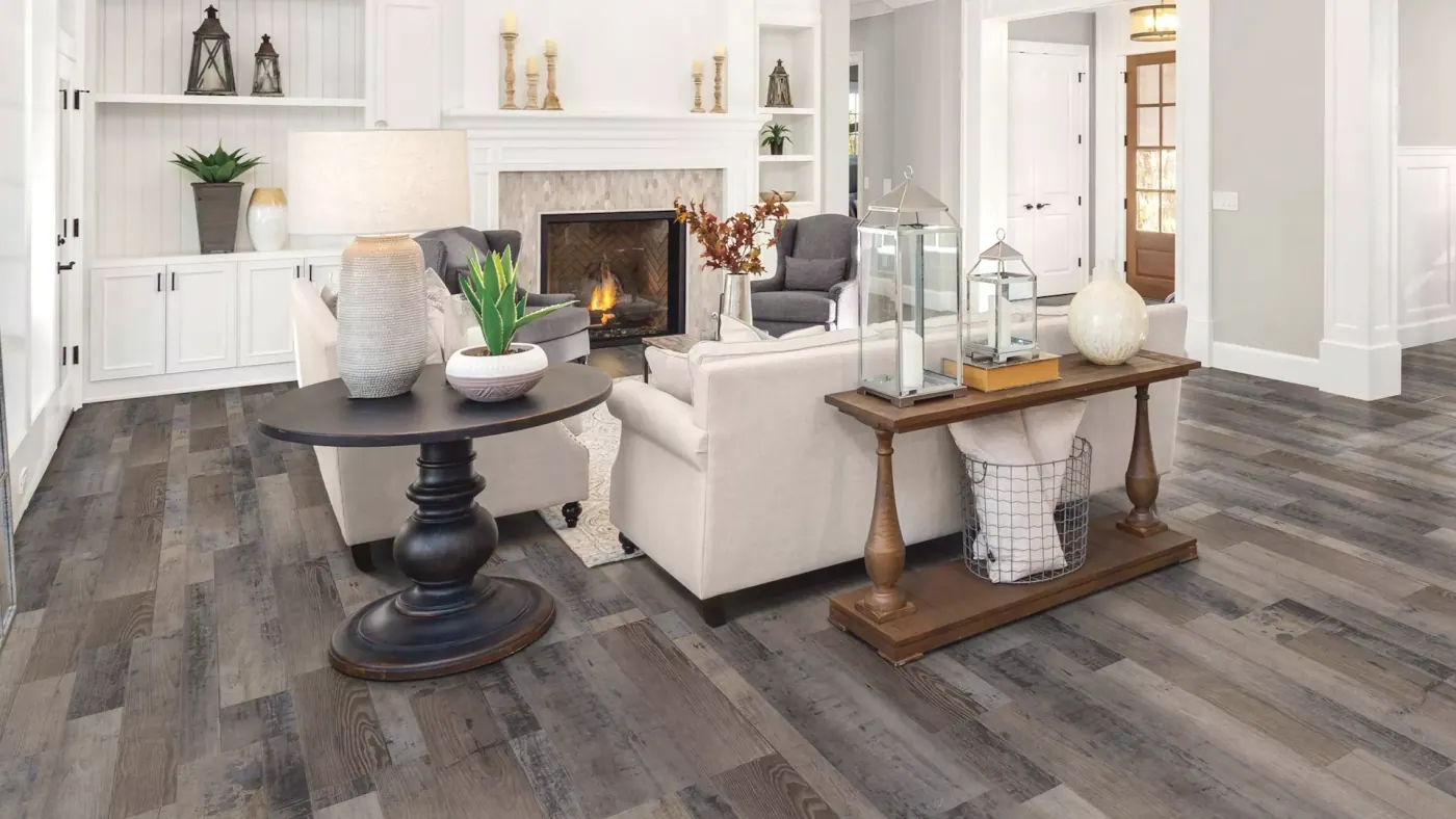 Luxury vinyl plank flooring in a living room with a fireplace in a Tulsa, OK home