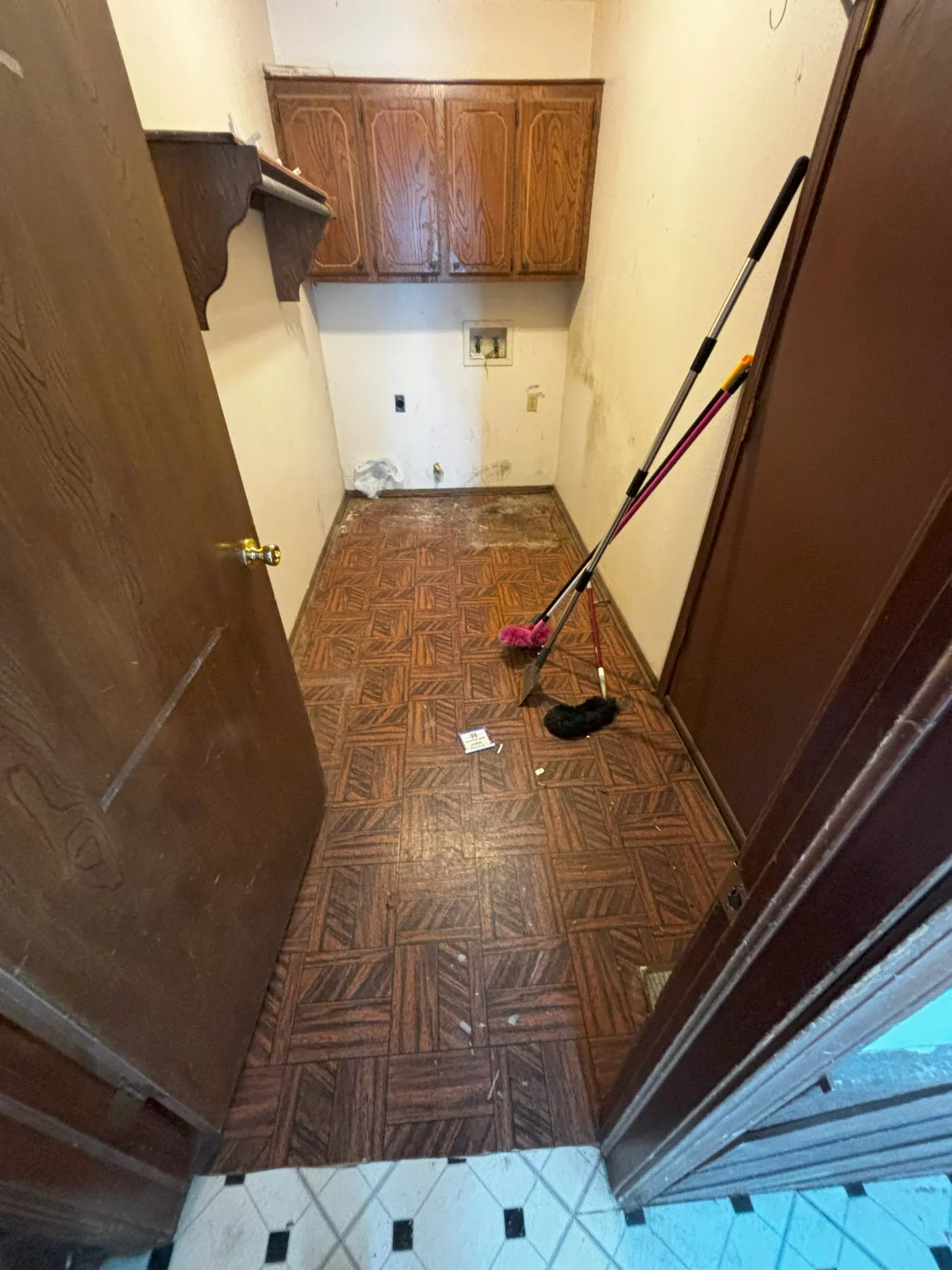 Old parquet flooring being removed during a flooring installation in Tulsa, OK