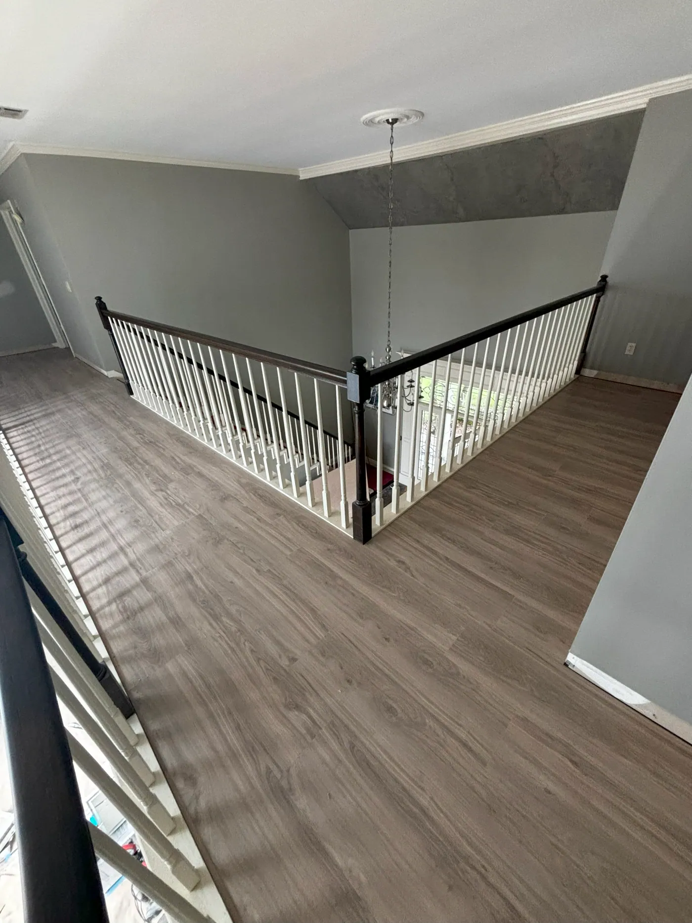 Luxury vinyl plank flooring on a staircase landing in a Tulsa metro home