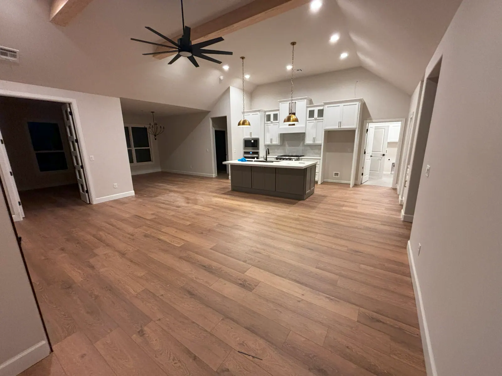 Light plank flooring running through a vaulted great room in a Tulsa metro home